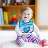 Adorable baby girl playing with educational toys in nursery Bavoir Happy hanouka