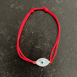 Bracelet fil rouge coulissant œil strass argent